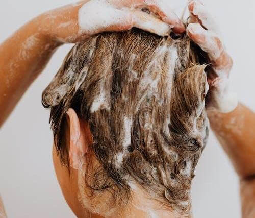 Adding coconut oil to your shampoo may save you time in adding additional steps to your haircare routine. 