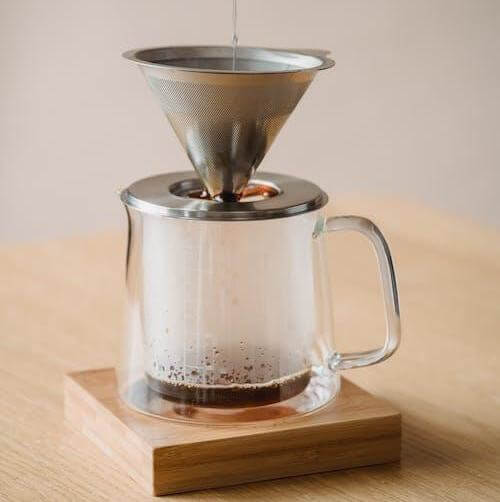 There’s some pretty neat coffee filter solutions for just about everyone.  Here’s a cute single serve non-disposable coffee filter solution.