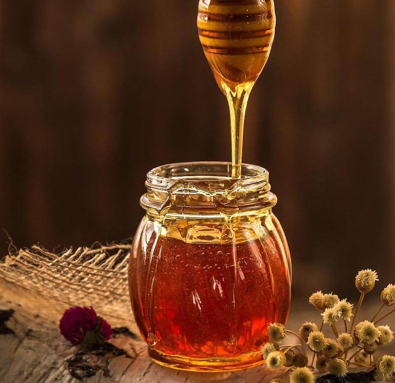 Honey is widely used as a natural sweetener and flavoring agent in foods and beverages.