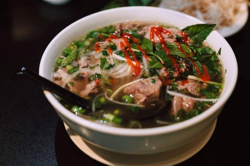 Pho made with rice noodles is usually gluten-free.  Ask your server if your choice of pho is made with gluten free noodles and fixings.
