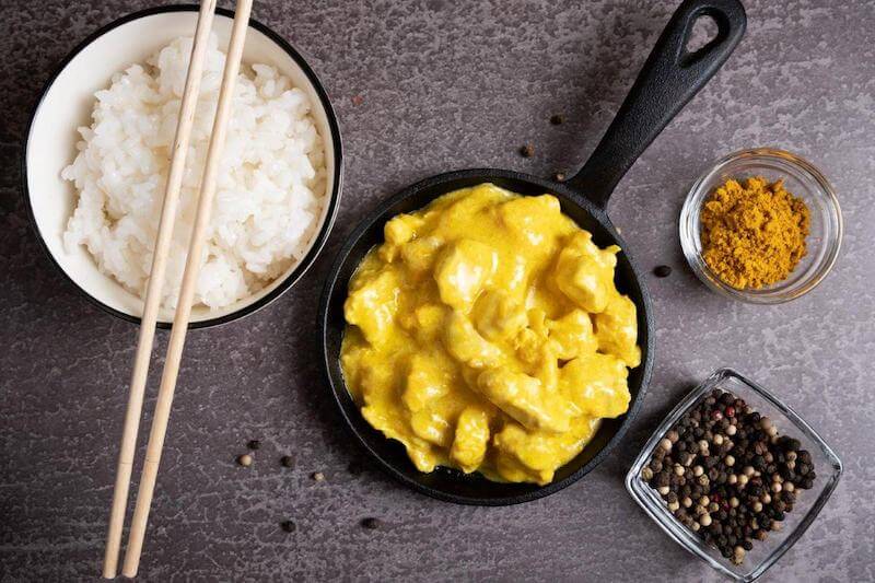 Delicious chicken curry made with turmeric with a side of rice.  Add black pepper and help your body absorb the turmeric nutrients more efficiently!
