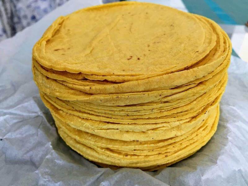These soft tortillas are made from yellow harina pan and is considered a staple due to its delicious texture and easiness on the family food budget.