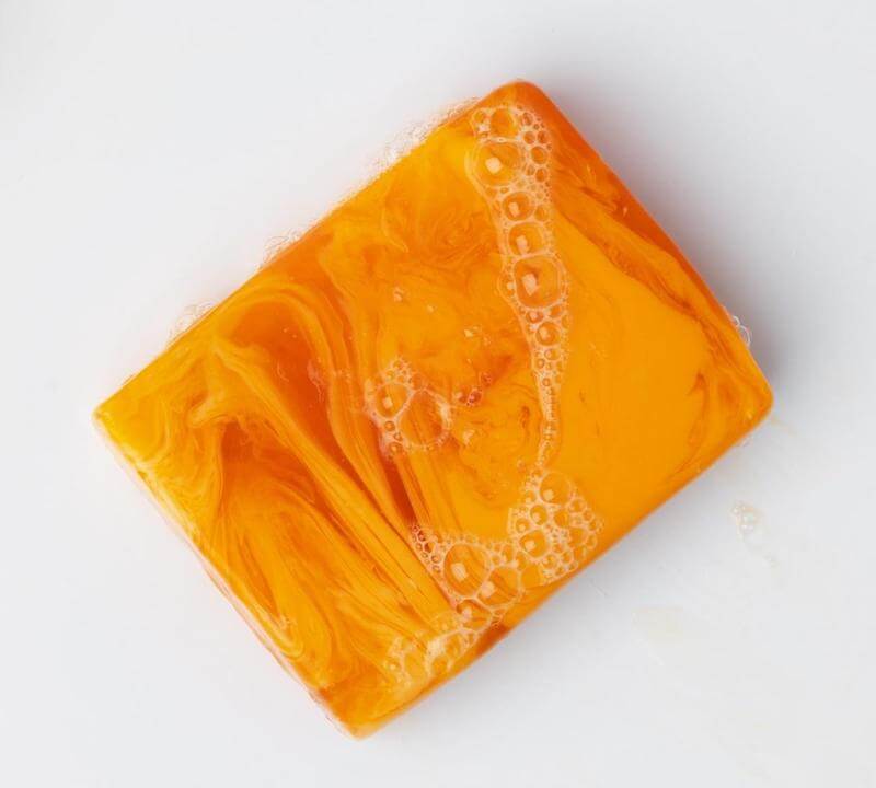 Choose a bright yellow-orange turmeric soap, some are brown and do not have as much turmeric potency in their recipe, for best results. 
