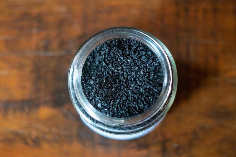 This simple, natural black powder is activated charcoal. It is the hero of the day when you feel sick to your stomach!