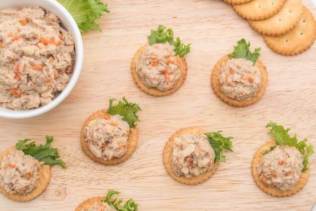 Crackers lend well to fish paste for a delicious appetizer. 