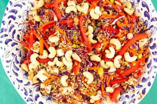 Get creative with your grains!  Adding quinoa to a colorful salad with cashews makes a healthy, balanced meal. 