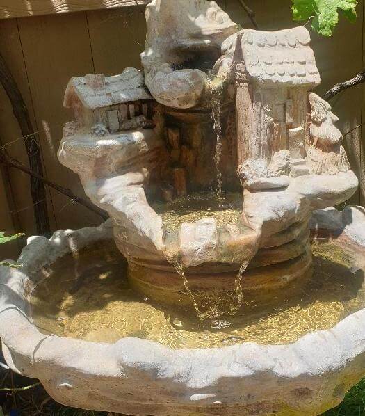 The old fountain that our 14 year old refurbished and is now delighting us in our front yard.  