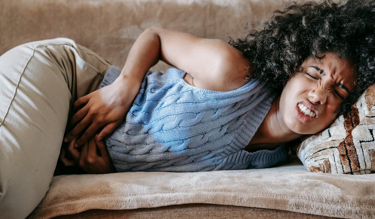 digestive bitters for bloating relief woman holding stomach