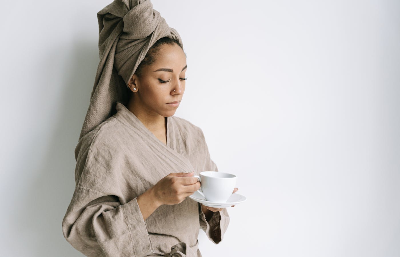 Calm woman with coffee after using the two minute rule for procrastination