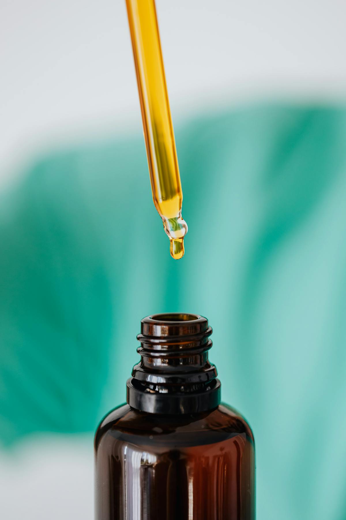 Amber glass dropper bottle of facial oil — squalane and jojoba mimic skin's natural lipid profile