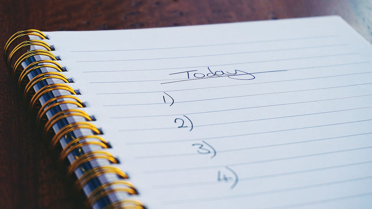 Coffee and notebook for a morning productivity routine with journaling
