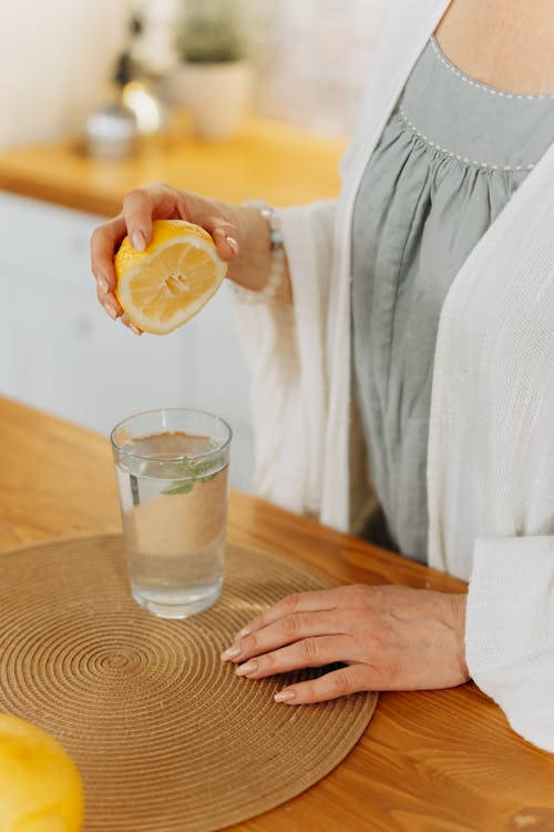 glass of water with detox powder being stirred in
