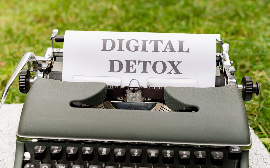 Typewriter displaying digital detox for mental health concept