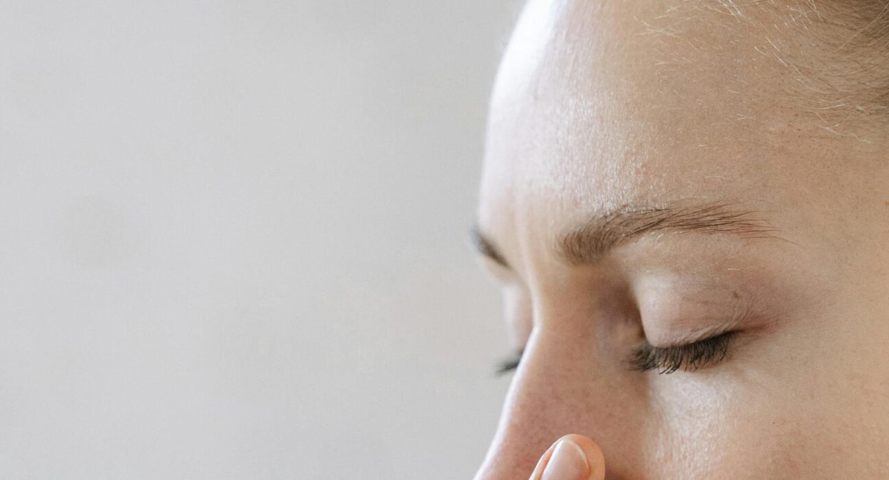 Woman practicing box breathing technique for stress relief