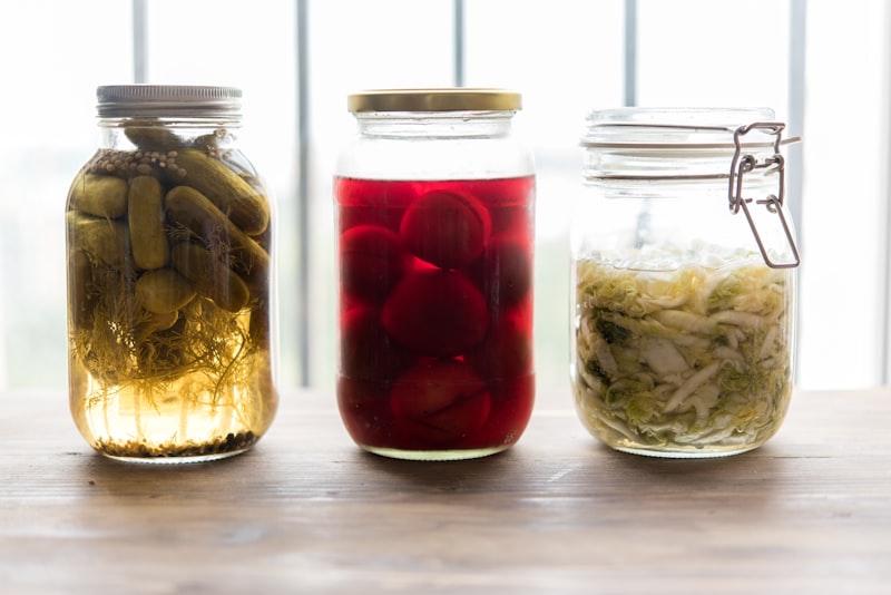 Jars of fermented foods like pickles and sauerkraut that support gut health