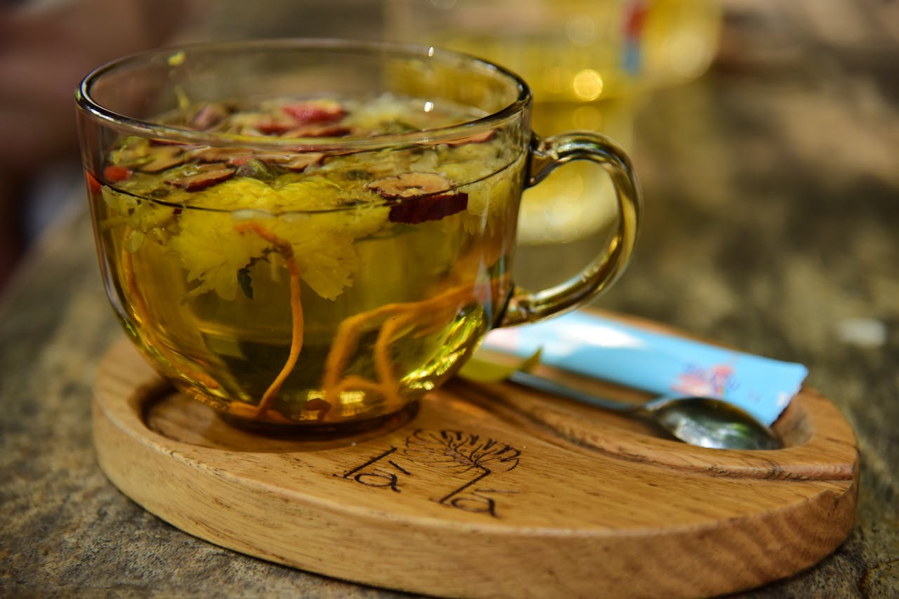 herbal tea with flowers in a clear cup