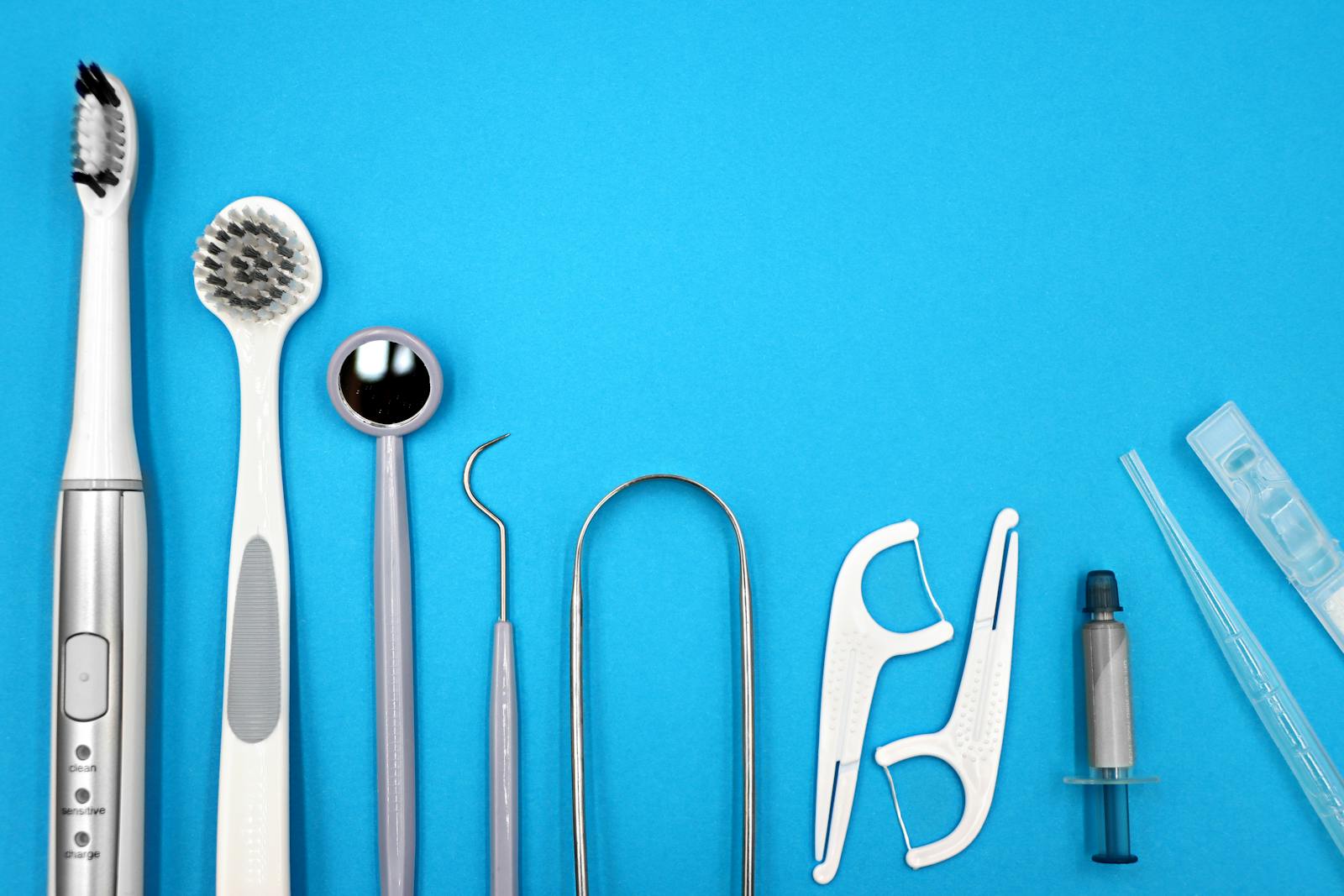 tongue scraping benefits flat lay of dental care tools