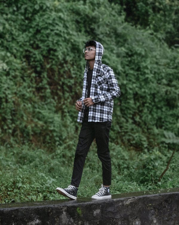 Man walking outdoors in nature as part of a digital detox for mental health