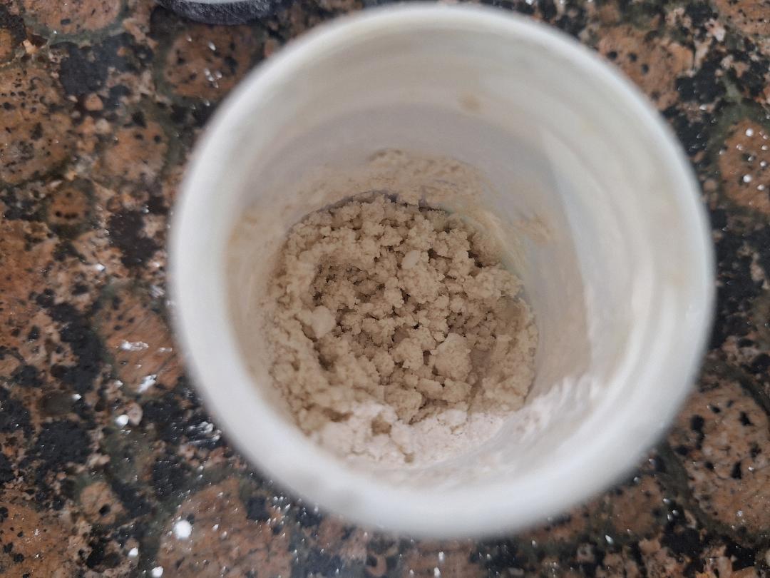 The finished pearl powder toothpaste mix showing the crumbly, slightly damp texture it should have
