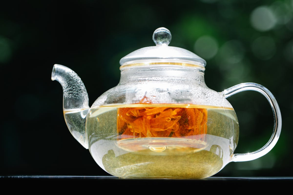 Glass teapot with nettle tea steeping for allergy relief