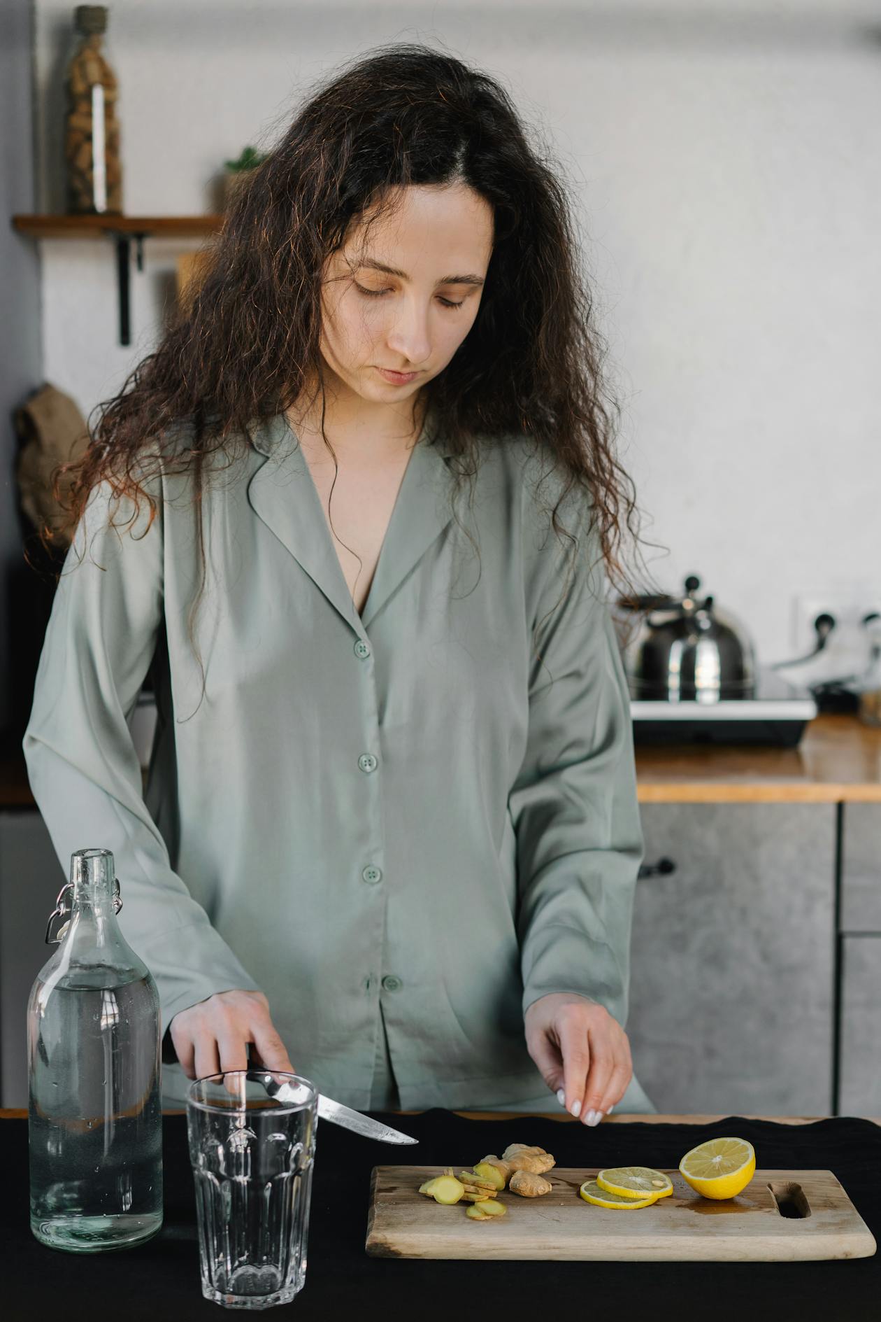 Woman preparing a healthy morning adrenal cocktail recipe at home