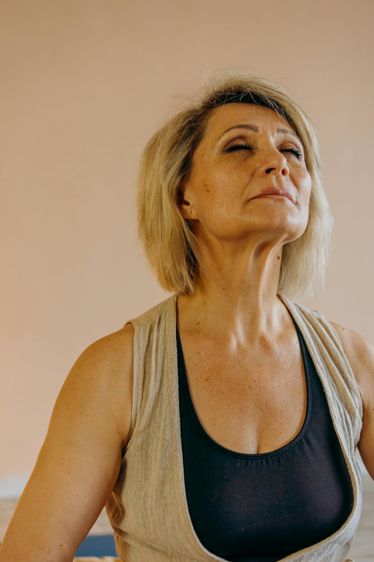 Woman doing deep breathing after the 5-4-3-2-1 grounding technique for anxiety