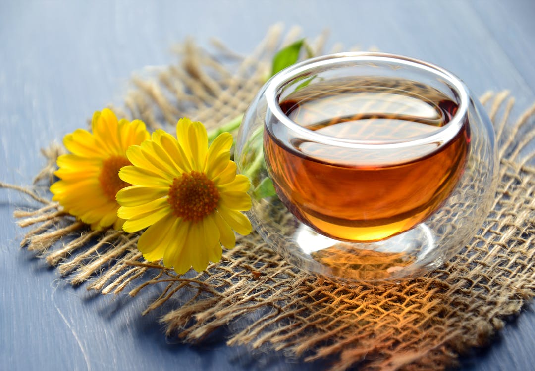 Close up of dandelion tea with herbs for liver health