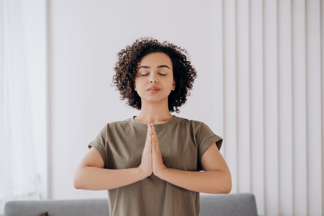 Woman meditating for calm and ashwagandha for anxiety management