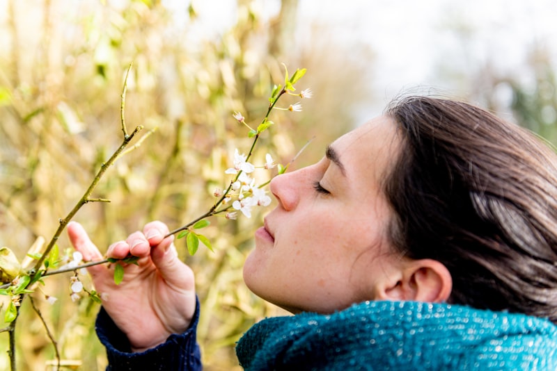 Woman outdoors during allergy season - improving gut health for allergies can help reduce symptoms naturally