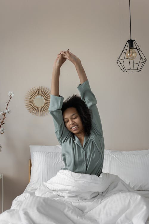 Woman stretching as part of morning habit stacking routine