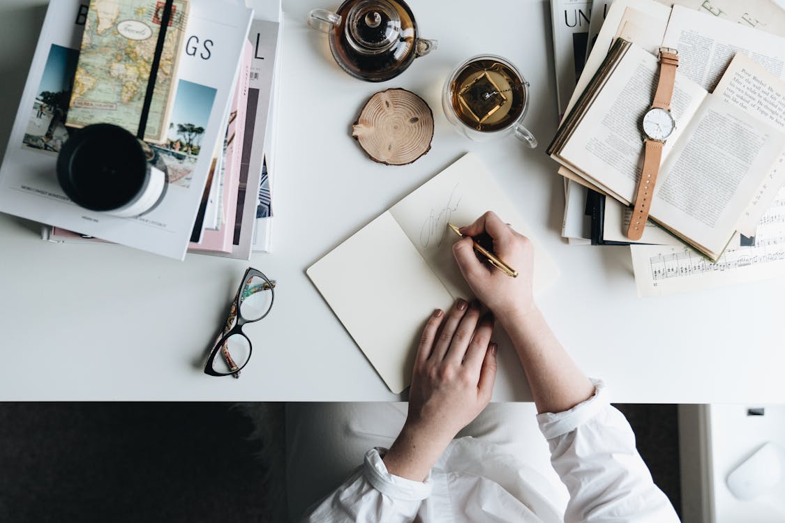 Writing in journal for daily accomplishments