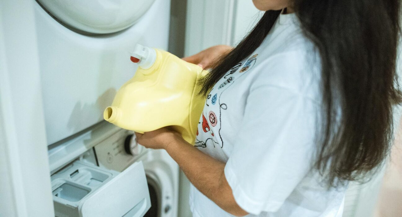 Three non-toxic laundry detergent products on a clean white shelf for side-by-side comparison