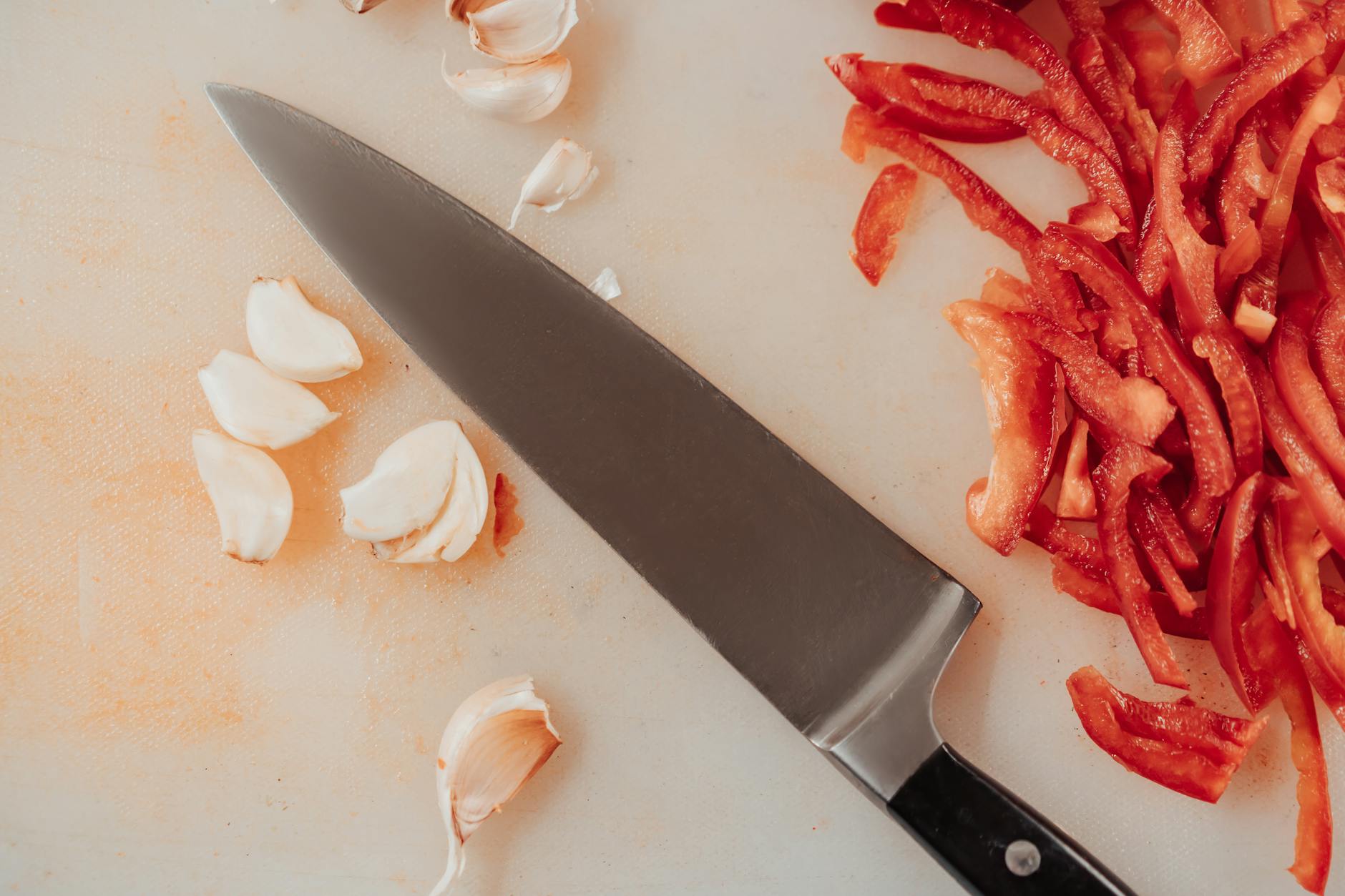Whole Garlic Cloves Cutting Board for Foods That Kill Parasites in Humans: The 12 Most Powerful Anti-Parasitic Foods (and How to Use Them)