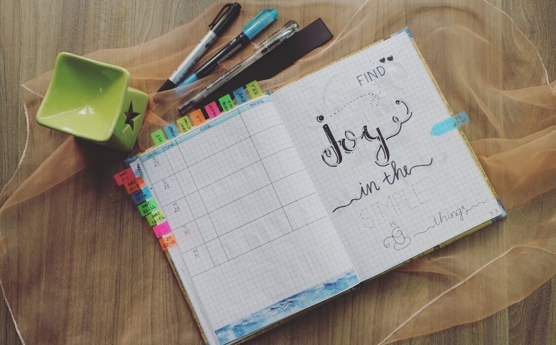 bullet journal flat lay for five minute journal vs bullet journal comparison