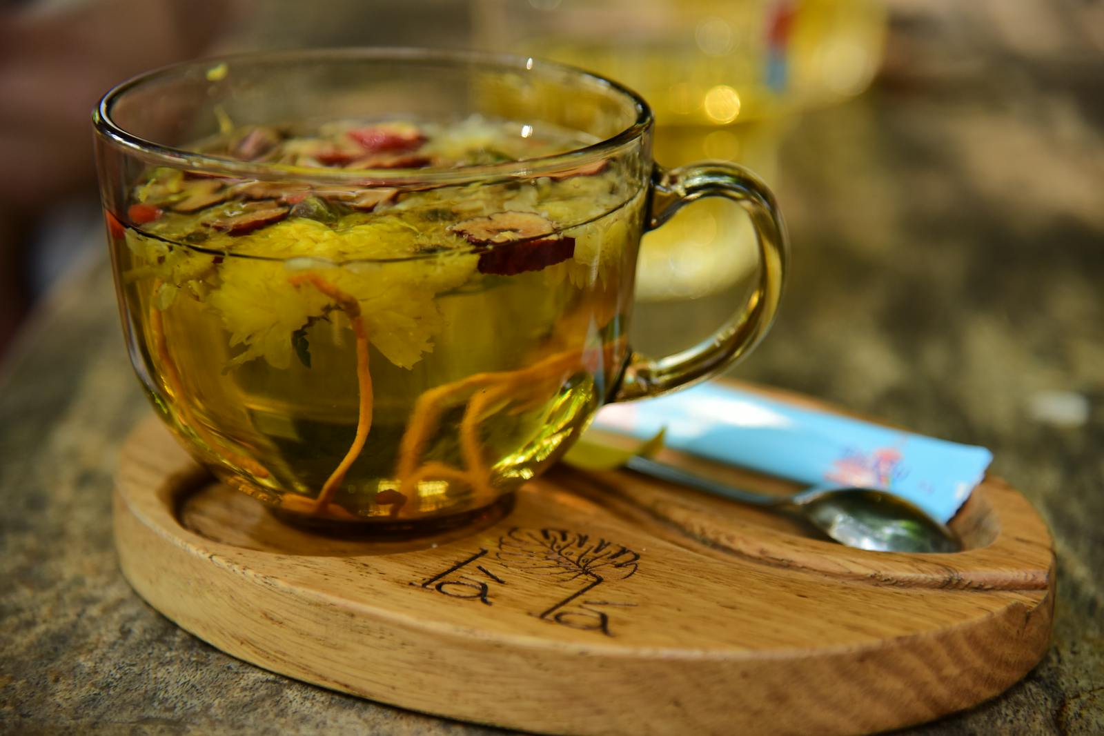 Burdock root tea steeping in a clear glass cup