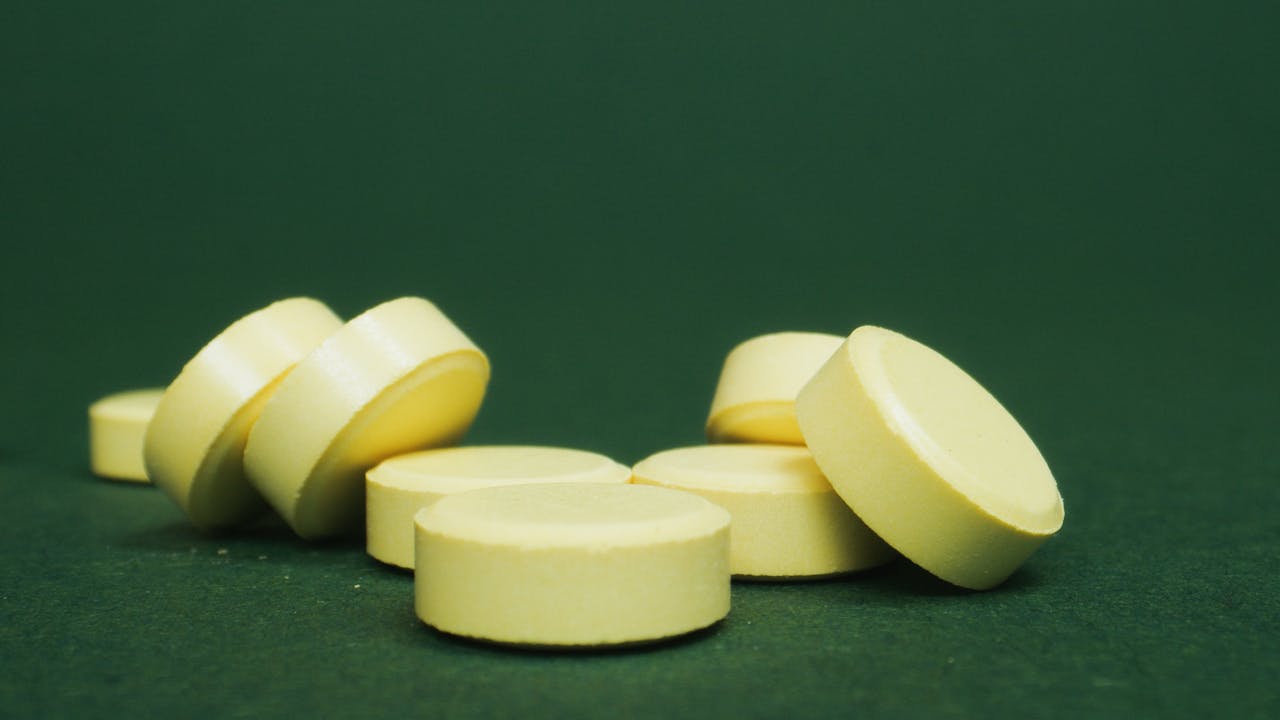 Chlorella tablets close-up showing green algae supplement form