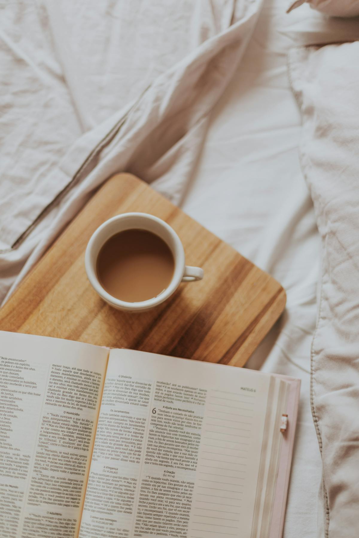 Cozy Sunday morning with book and coffee in bed for a Sunday reset