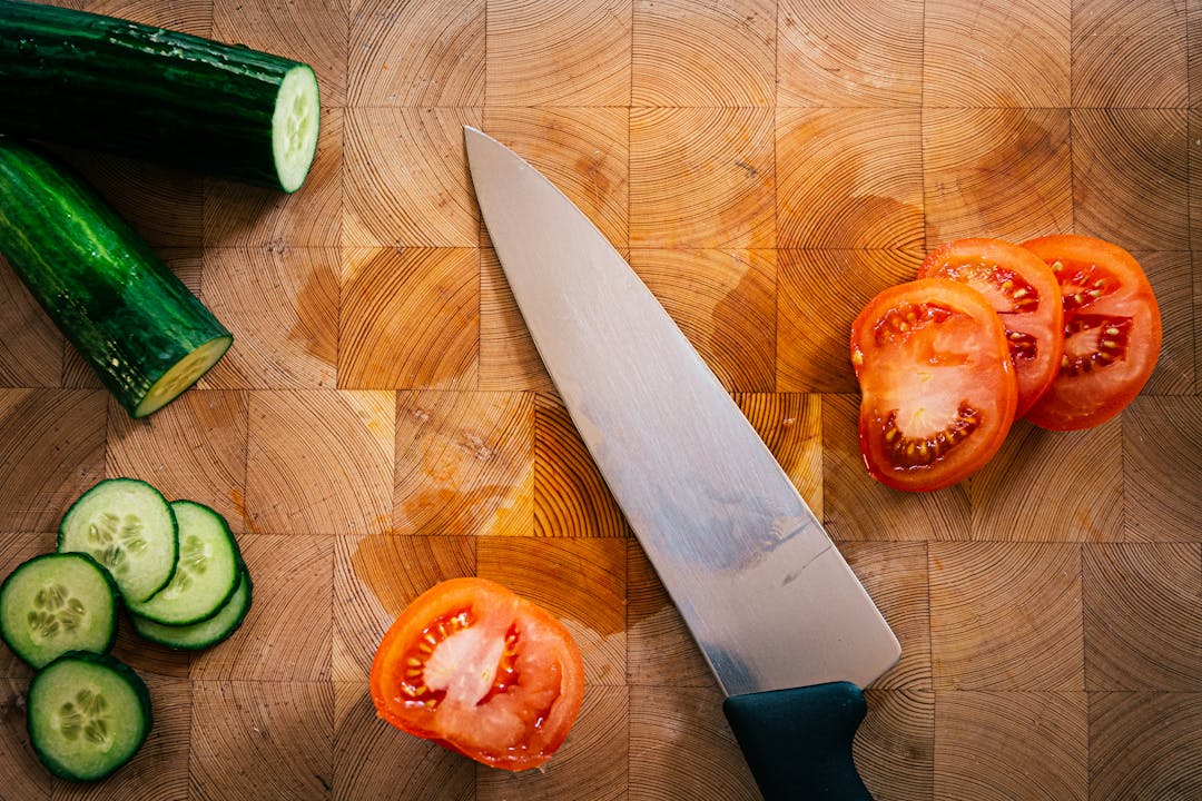 Colorful vegetables on wooden cutting board
