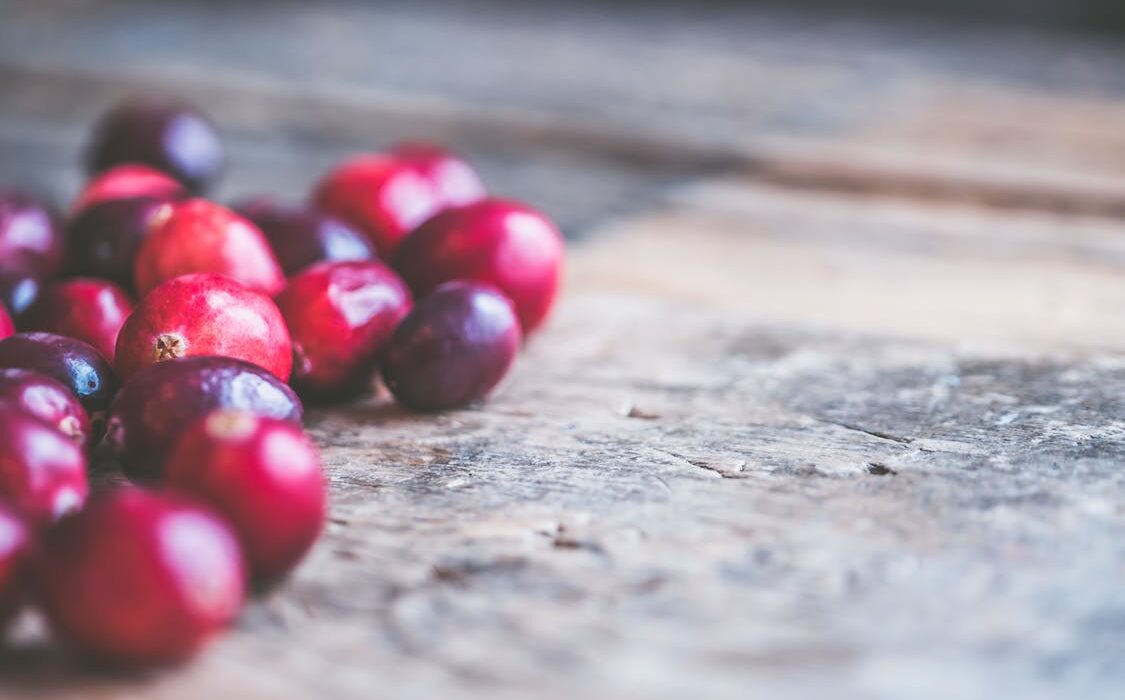 fresh cranberries on white background for d-mannose source
