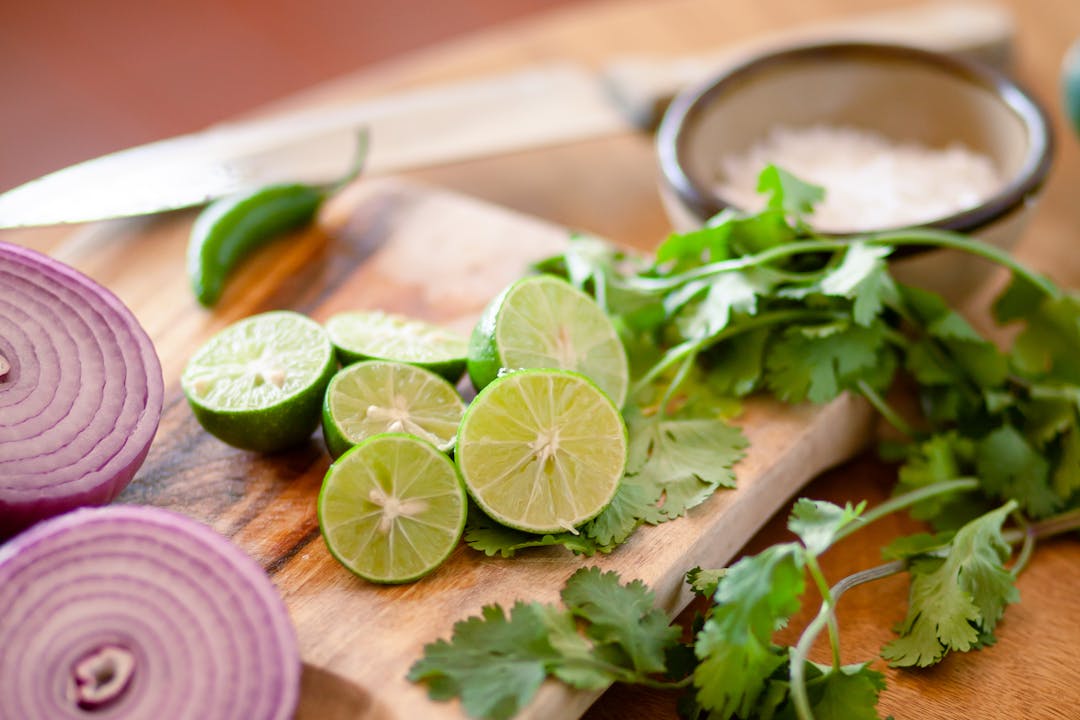 Fresh cilantro on a wooden cutting board