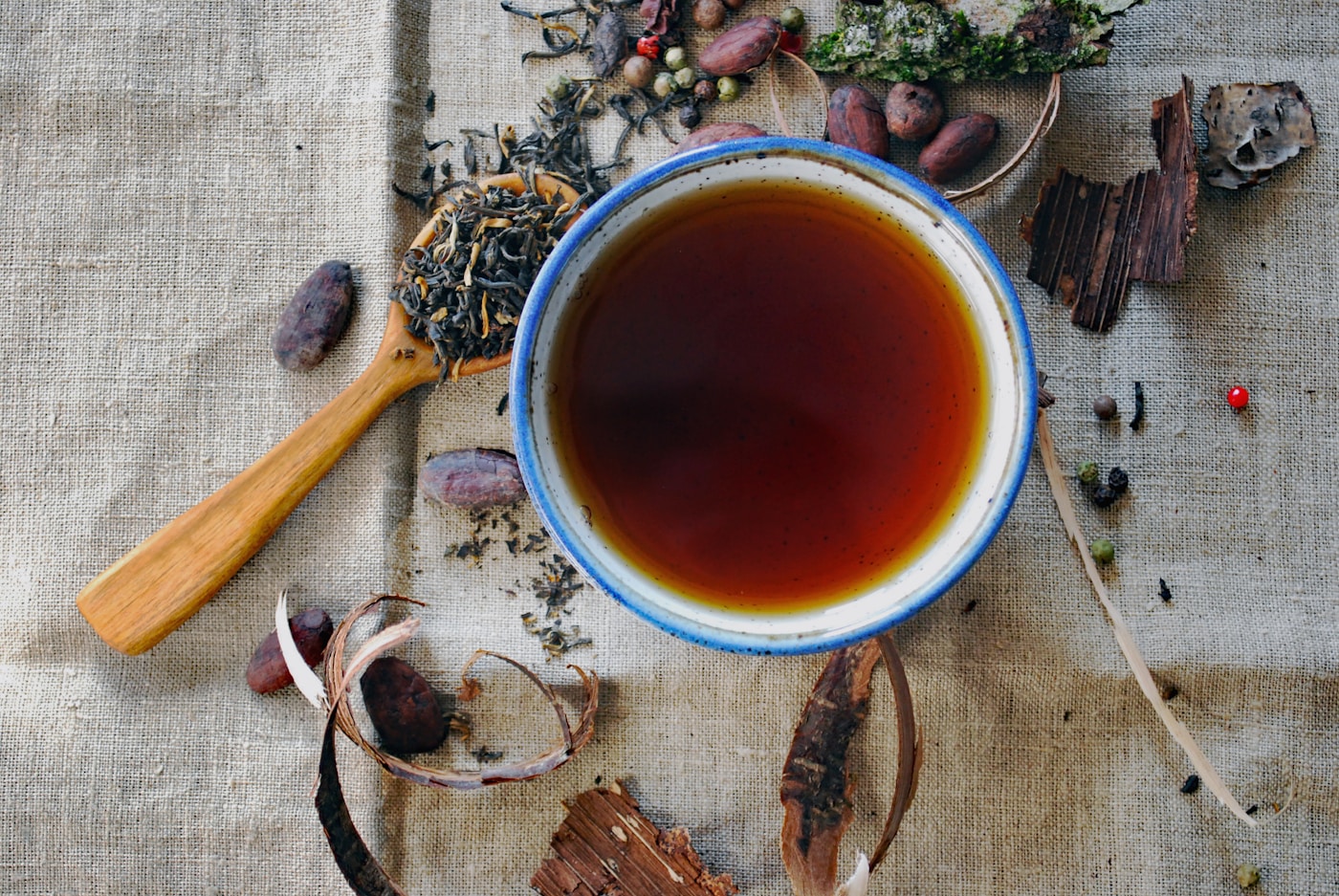 Brewing herbal tea with hot water and a covered mug