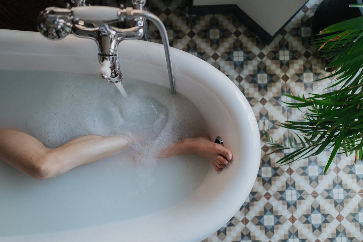 Bathtub with foam relaxing detox foot soak similar to bentonite clay detox bath