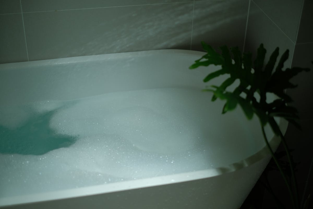 Relaxing indoor bubble bath natural setting bentonite clay detox bath time