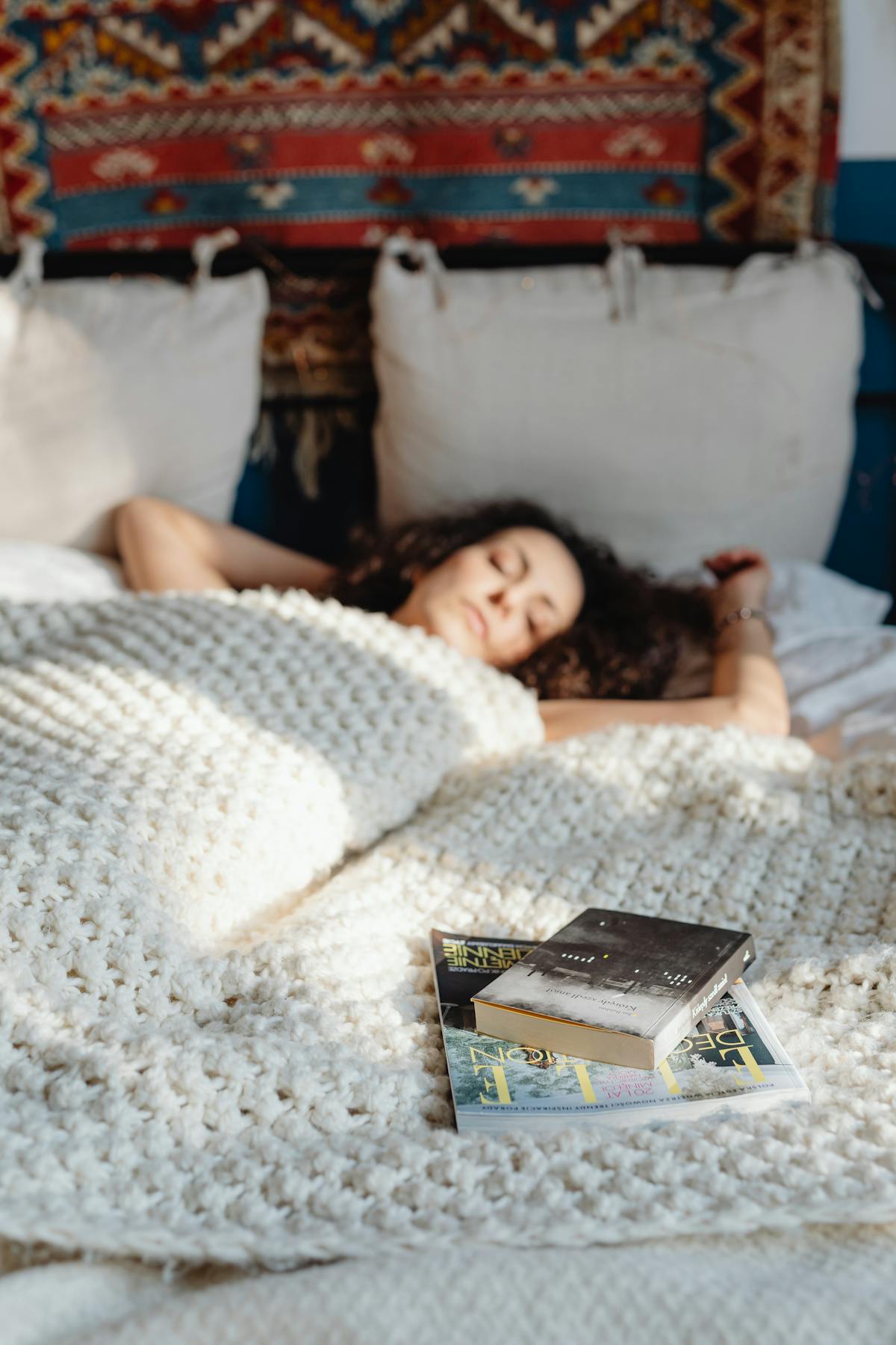 Woman resting with a book during castor oil pack for liver session