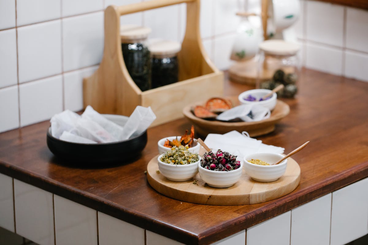 Dried herbs and spices in bowls used for parasite cleanse at home