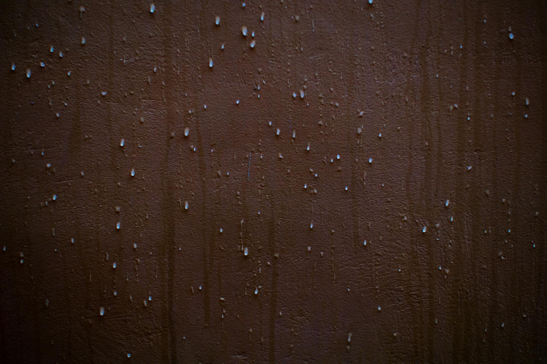 Water-damaged ceiling with moisture stain