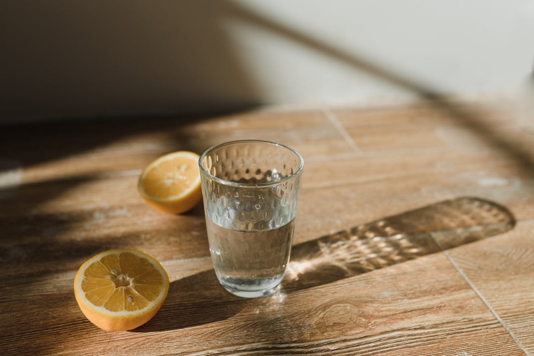 Glass of lemon water with fresh ginger, morning routine