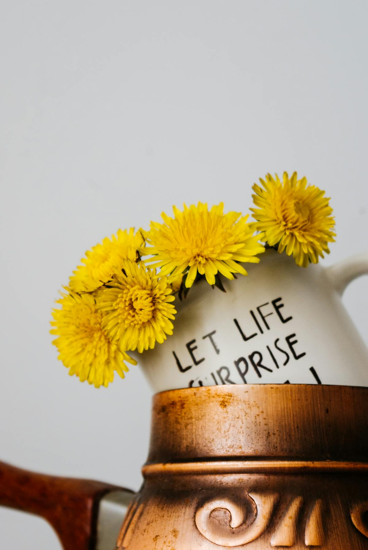 Ceramic cup with bright dandelion flowers a calming tea ritual
