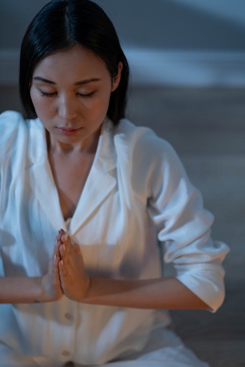 woman quietly practicing negative visualization for daily calm