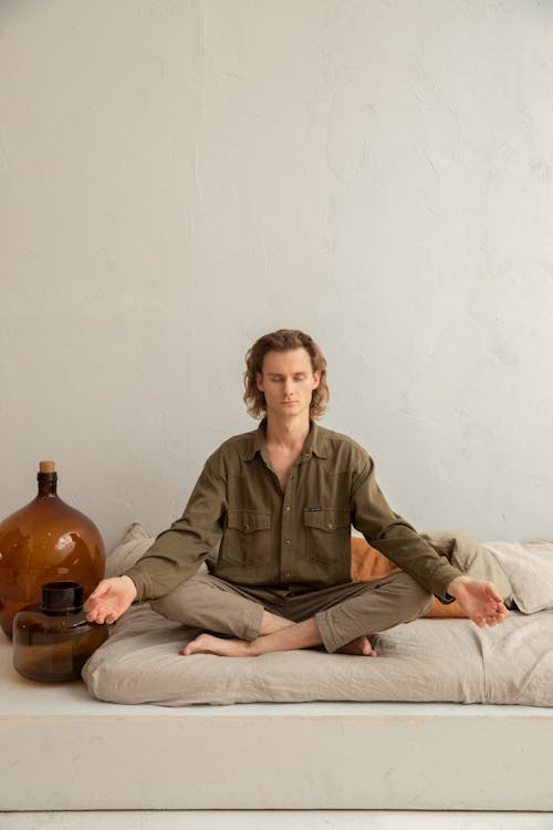 man sitting cross legged practicing stoic reflection
